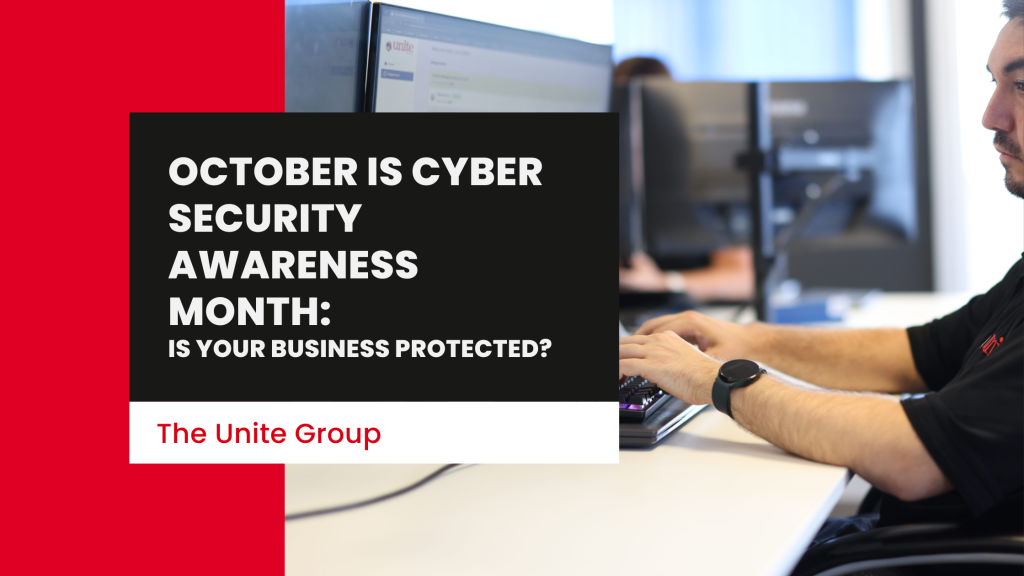 A the unite group employee working at a desk on a computer. text reads: October Is Cyber Security Awareness Month: Is Your Business Protected?