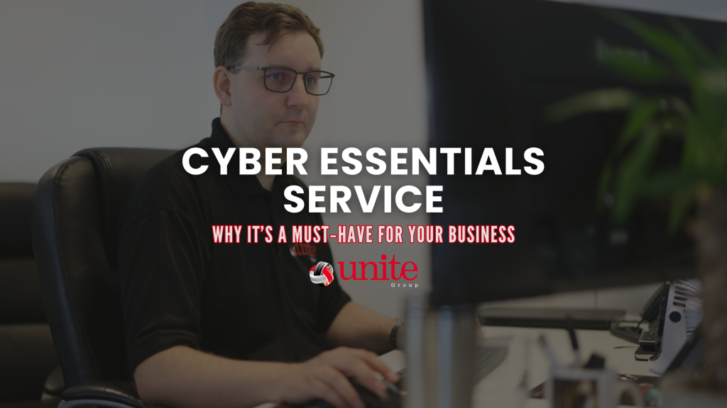 A Unite Group employee working at a desk on a computer