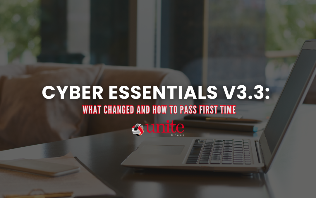 A computer on a desk with notes and a pen next to it -Cyber Essentials v3.3: What Changed and How to Pass First Time