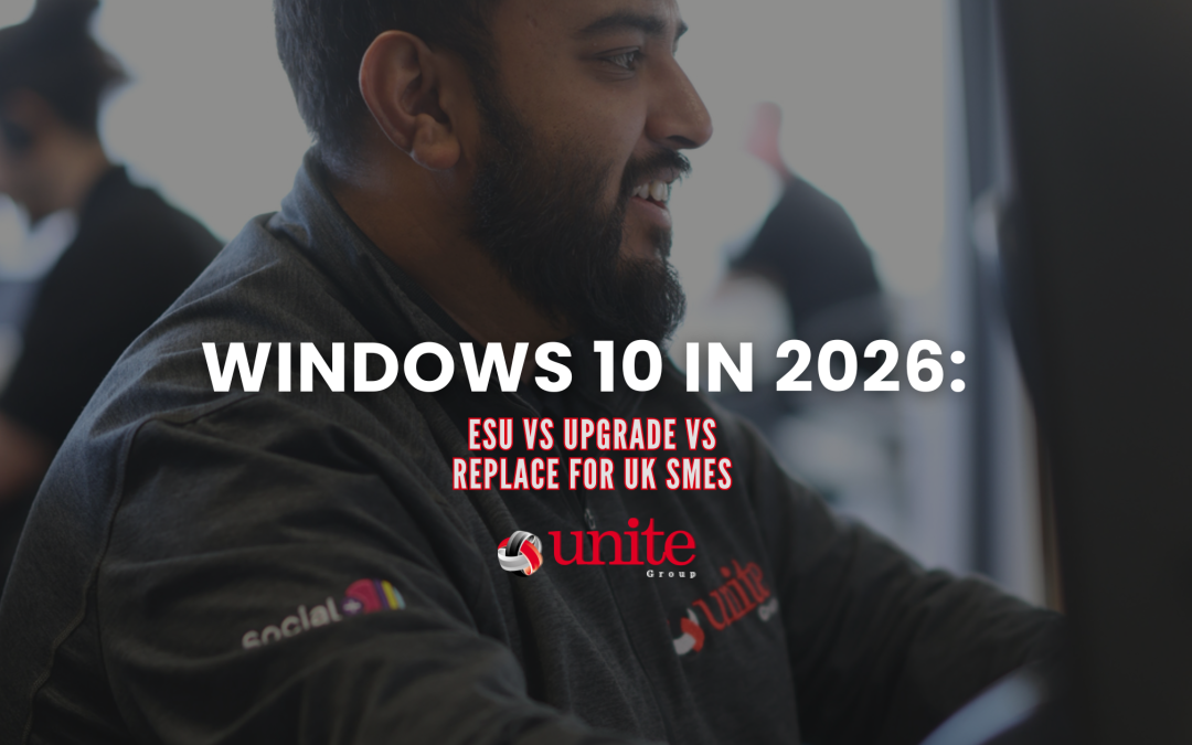 A unite group employee sitting at a computer