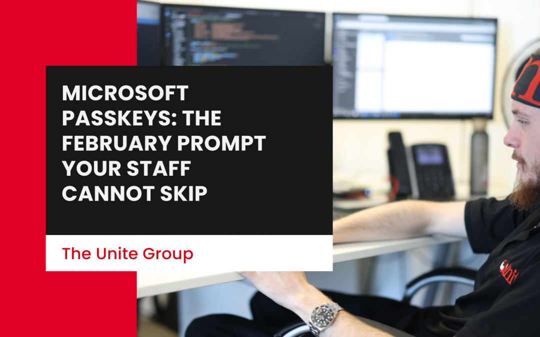 A unite group employee sat at a desk on a computer - Microsoft passkeys: the February prompt your staff cannot skip